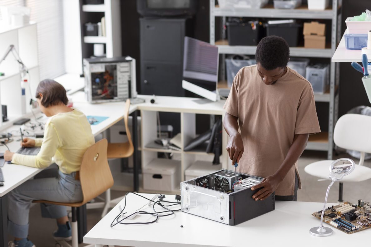 people repairing computer chips